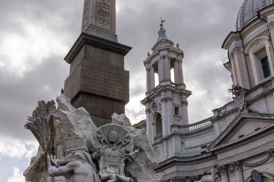 Piazza Navona with fountain Quattro Fiumi and ancient egyptian obelisk in Rome. Church of Sant Agnese. Italy