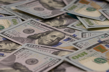 A pile of one hundred US banknotes. Cash of hundred dollar bills, dollar background image