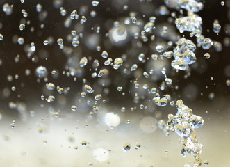 Water splashing from a fountain on summer nature
