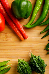 Raw vegetable on wooden board with copy space  