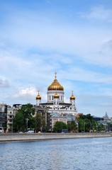 Fototapeta na wymiar Moscow, Russia - May 13, 2019: The view of the Cathedral of Christ the Savior from the Krymskaya embankment on a sunny day