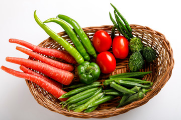 Raw vegetable in wooden basket  