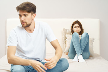 young couple sitting on sofa at home