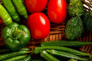 Raw vegetable in wooden basket  