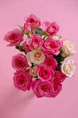 Floral composition with a pink roses on pink background. Valentine's Day background. Flat lay, top view.