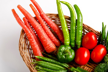 Raw vegetable in wooden basket  