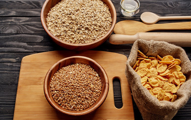 spices in bowls on wooden background