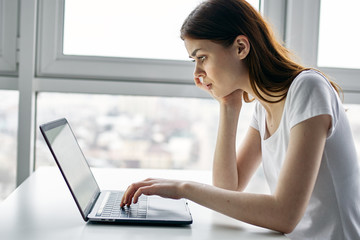 woman working on laptop at home