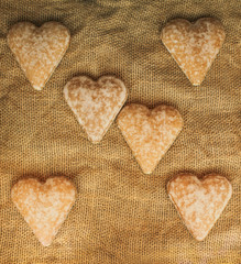 Background Valentine's Day organic gingerbreads hearts on burlap
