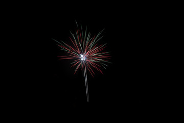 Minimalistic Fireworks against black background on New Year's Eve