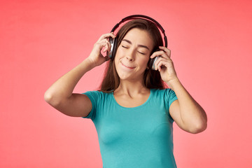 young woman listening to music with headphones