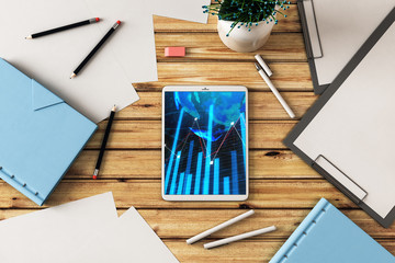 Digital tablet closeup top view with financial graph and partial world map on screen. Online international trading application concept. 3d rendering.