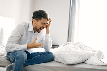 young man sitting on sofa