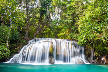 Waterfall and blue emerald water color in Erawan national park. Erawan Waterfall , Beautiful nature rock waterfall steps in tropical rainforest at Kanchanaburi province, Thailand