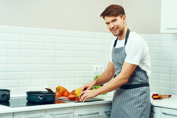 man preparing food in the kitchen