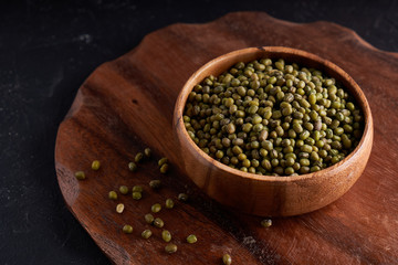 cereal mung beans mung in wooden bowl on black background