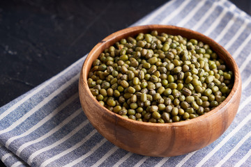 cereal mung beans mung in wooden bowl on black background
