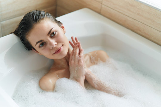 young woman in bubble bath