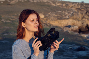 woman taking photo with vintage camera