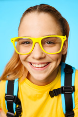 portrait of little girl in glasses