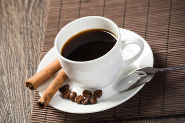 Cup of espresso coffee on wooden table