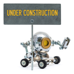 Steampunk robot holding metal sign with text 