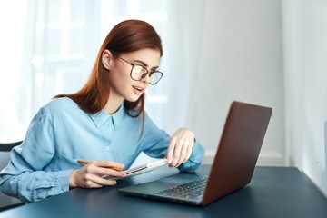 businesswoman working on laptop in office