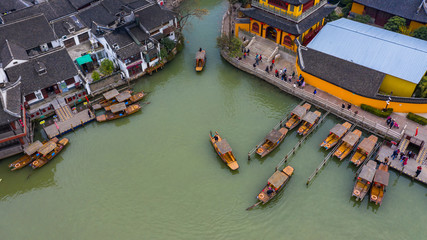 Fototapeta na wymiar Aerial view Zhujiajiao Water Town and China traditional tourist boats on canals of Shanghai Zhujiajiao Water Town in Shanghai, China.