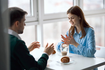 young couple drinking coffee in cafe