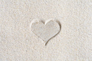 Drawn Valentines heart on the sand at the beach. Concept