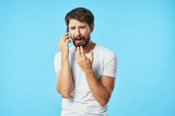 young man talking on the phone isolated on white