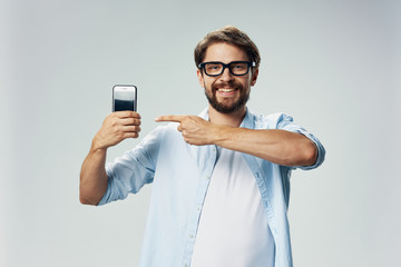portrait of young man with mobile phone
