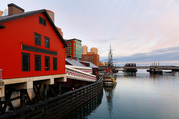 Naklejka premium Boston Harbor at sunrise viewing from Fan Pier Park. Boston Harbor is a natural harbor and estuary of Massachusetts Bay,