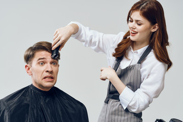 man and woman fighting over white background