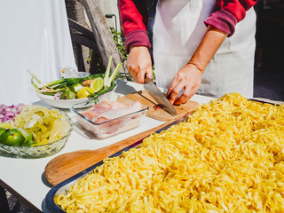 Tourists are training to cook Thai food called Khao Soi chicken at the local cooking training institute