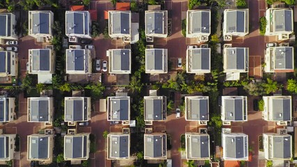 Aerial pass above Middle class Suburban neighbourhood houses.