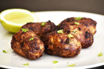 Sheftalia : Cypriot Lamb and Pork Sausages. Traditional Cypriot food. Grilled sausages on white...