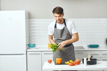 man preparing food in the kitchen