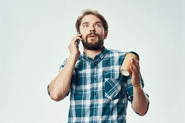 young man talking on the phone isolated on white