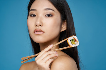 young woman with chopsticks