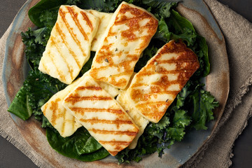 Cyprus fried halloumi cheese with healthy green salad. Lchf, pegan, fodmap, paleo, scd, keto diet.