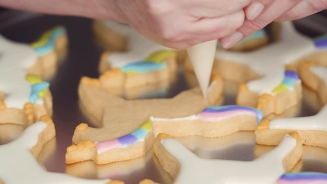 Step by step. Decorating unicorn sugar cookies with royal icing.