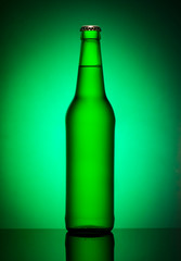 Bottle of beer on green
