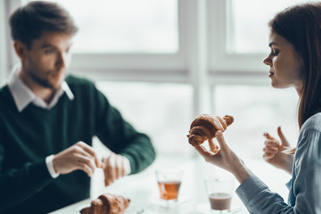 man and woman shaking hands in office