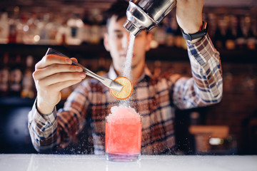 Barman mixes cocktail show with colorful alcoholic cocktails bar counter