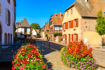 Fototapeta na wymiar Colorful houses on street in picturesque Kintzheim village, Alsace Wine Route, France