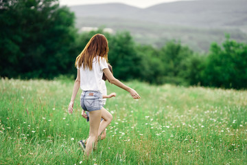Fototapeta premium young woman running in the field