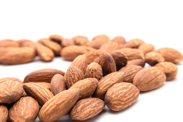 Close up group of peeled Almond nuts with white background. healthy snack