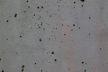 modern grey wall with holes