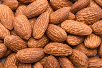 Close up peeled almond nut, almond background texture. healthy food and snack concept.